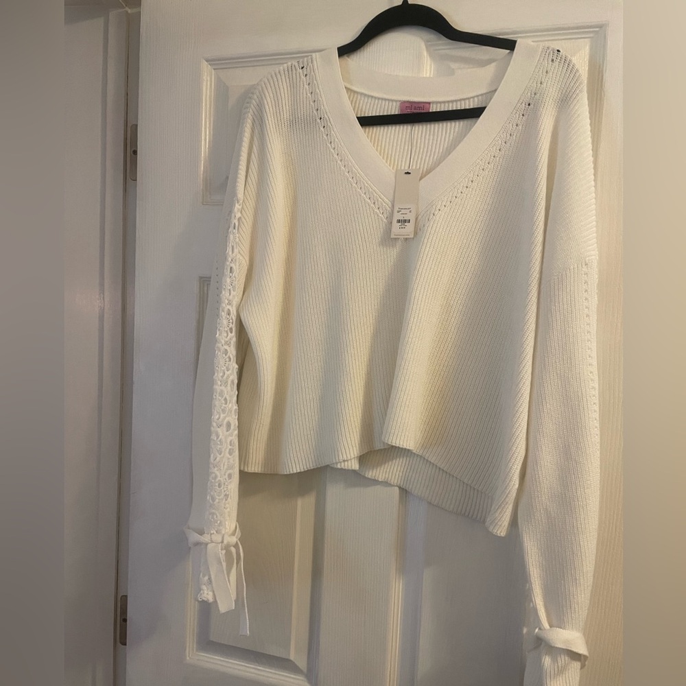 Beautiful bell sleeves with tie sweater